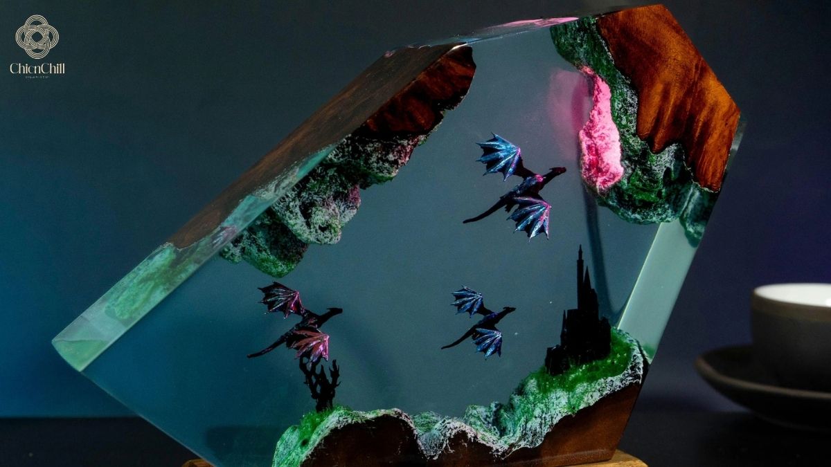 A sculptural handmade resin lamp that brings a vivid fantasy scene to life through layered textures and ambient, color-changing light.