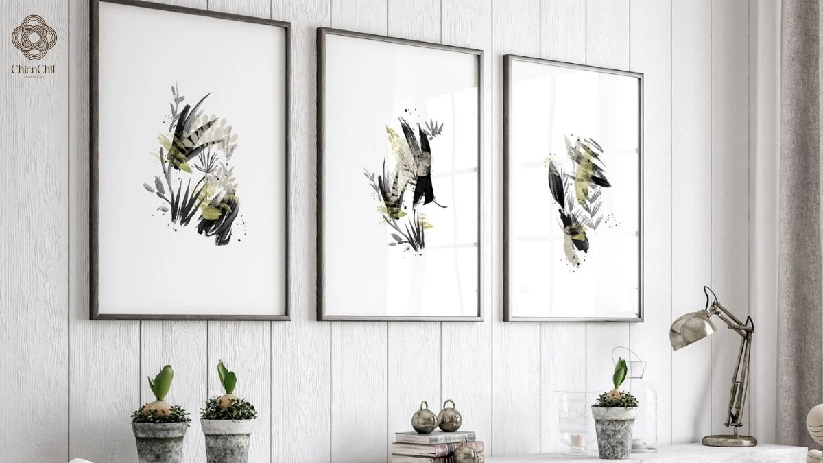 Minimalist botanical triptych art in sleek frames for a clean, sophisticated vibe